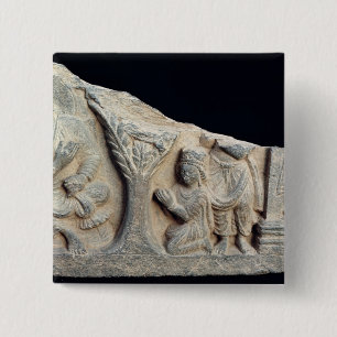 Detail of relief frieze depicting a seated 15 cm square badge