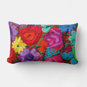 Detail of traditional embroidery floral textile lumbar cushion