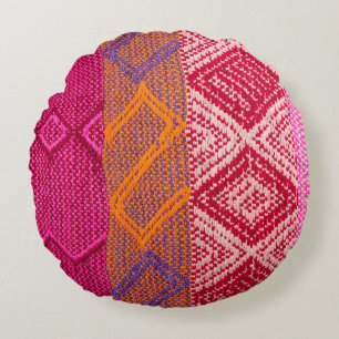 Details shot of indian fabric with colourful patte round cushion