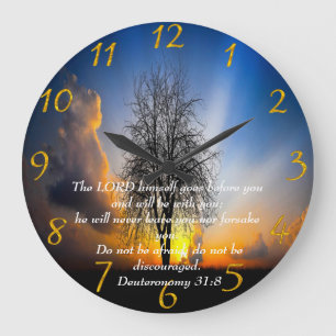 Deuteronomy 31:8 tree in a field with blue sky   large clock