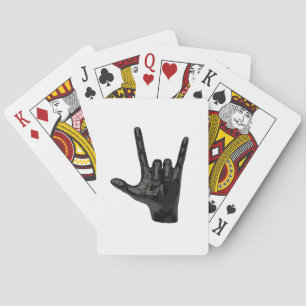 devil horns hand playing cards