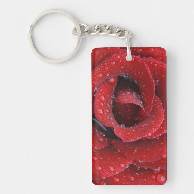 Dew covered red rose decorating grave site in key ring (Front)
