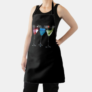 Different cocktails in martini glasses on black apron