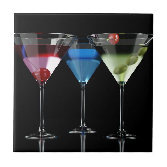 Different cocktails in martini glasses on black ceramic tile (Front)