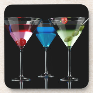Different cocktails in martini glasses on black coaster