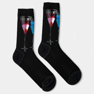 Different cocktails in martini glasses on black socks