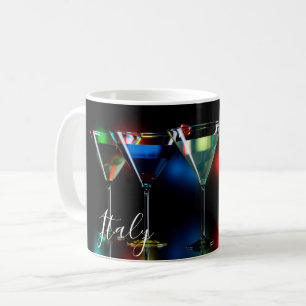 Different cocktails in martini glasses with lights coffee mug