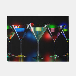 Different cocktails in martini glasses with lights doormat