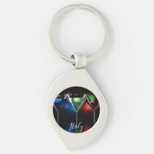 Different cocktails in martini glasses with lights key ring