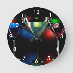 Different cocktails in martini glasses with lights round clock