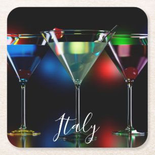 Different cocktails in martini glasses with lights square paper coaster