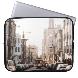 DIFFERENT VEHICLES ON ROAD DURING DAYTIME LAPTOP SLEEVE