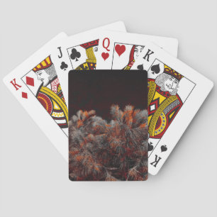 Digital art of pine tree with orange colour spots playing cards