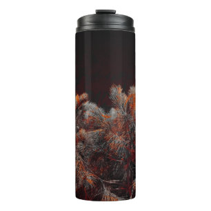 Digital art of pine tree with orange colour spots thermal tumbler