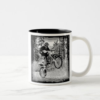 Dirt bike wheeling in the woods Two-Tone coffee mug