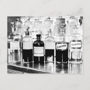 Display of apothecary bottles containing drugs postcard