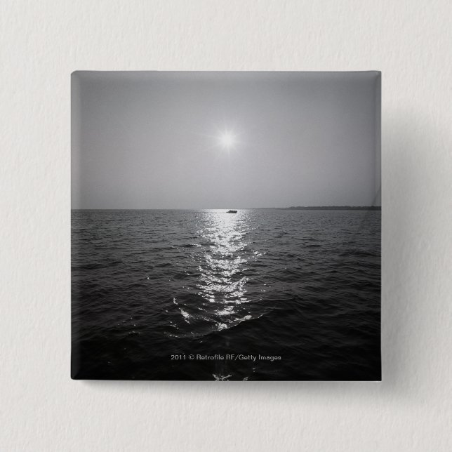 Distant boat on ocean 15 cm square badge (Front)