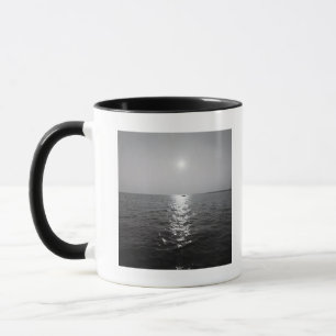 Distant boat on ocean mug
