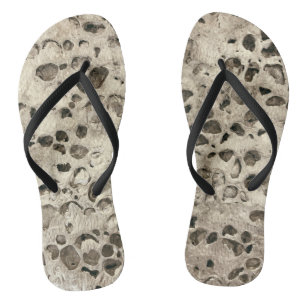 Distressed concrete small stones rocks beach thongs