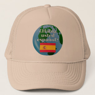 Do you speak Spanish? in Spanish. Flag & globe Trucker Hat
