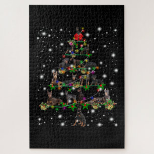 Doberman Christmas Tree Covered By Flashlight Jigsaw Puzzle