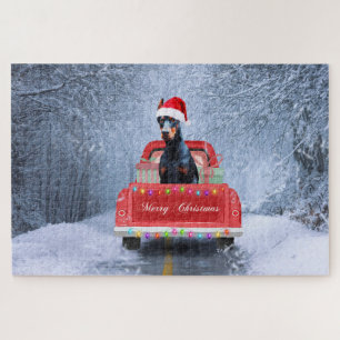 Doberman Dog in Snow sitting in Christmas Truck Jigsaw Puzzle