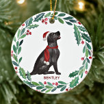 Dog Christmas Personalised Pet Black Labrador  Ceramic Ornament<br><div class="desc">Decorate your tree or give a special gift this holiday season with this elegant Merry Christmas black labrador retriever in a wreath design christmas ornament, and matching decor. This black labrador christmas ornament features a watercolor dog in a green and red wreath with holly and berries. Personalise with name front,...</div>