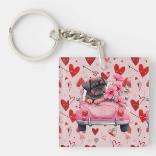 Dog in a car with hearts key ring