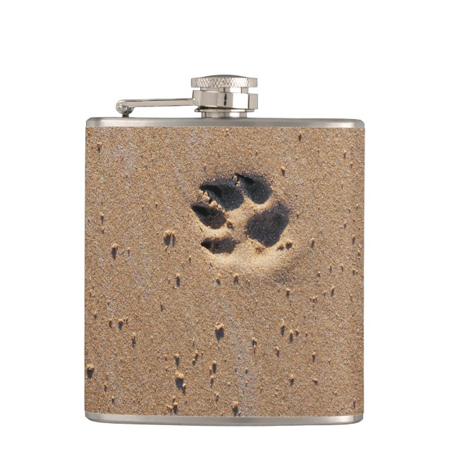 Dog paw prints on a sandy beach hip flask (Front)