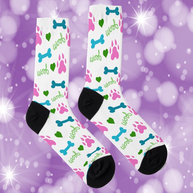 Dog Paws Bones Hearts Woof Pink Green Blue Socks (A cute pair of socks with pink dog paws, blue bones, green hearts and green woof.)