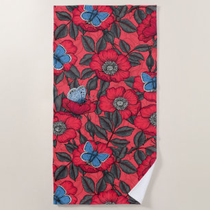 Dog rose and butterflies in red and blue beach towel