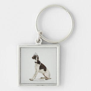 Dog sitting with a tiara on head key ring