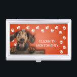 Dog Walker Paw Prints Business Card Holder<br><div class="desc">This business card holder,  personalised with your name,  features a cute Dachshund on bright orange with a white paw print border. Fun as a gift or a great way to carry your own business cards.</div>