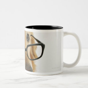 Dog wearing tie and glasses sitting on chair in Two-Tone coffee mug