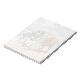 Dogs playing at the beach notepad