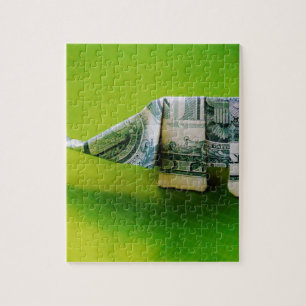 Dollar bill origami Elephant on Green background Jigsaw Puzzle