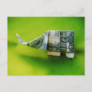 Dollar bill origami Elephant on Green background Postcard