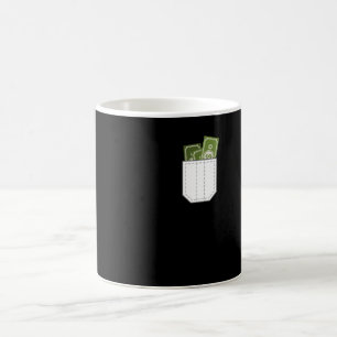 Dollars peeking out of pocket coffee mug