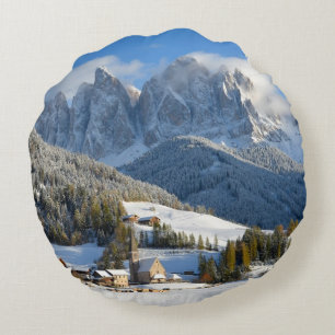 Dolomites village in winter round pillow