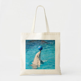 Dolphin having a ball tote bag