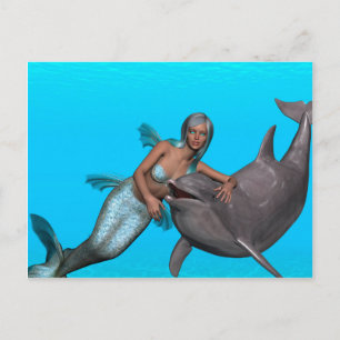 Dolphin swimming with a mermaid postcard