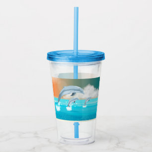 dolphins breaching in the ocean acrylic tumbler
