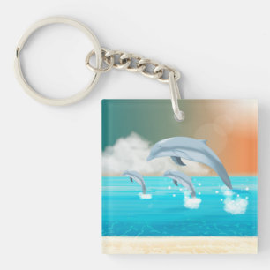 dolphins breaching in the ocean key ring