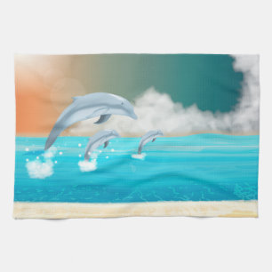 dolphins breaching in the ocean tea towel