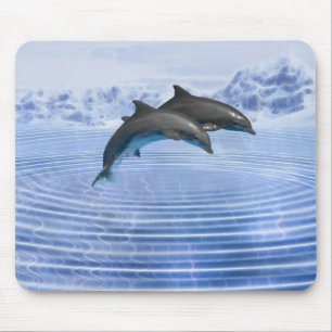Dolphins in the clear blue sea mouse pad