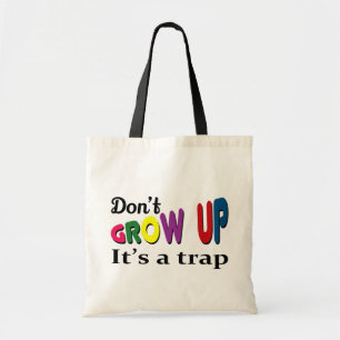 Don't grow up it's a trap tote bag