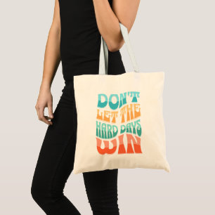 Don't let the hard days win tote bag
