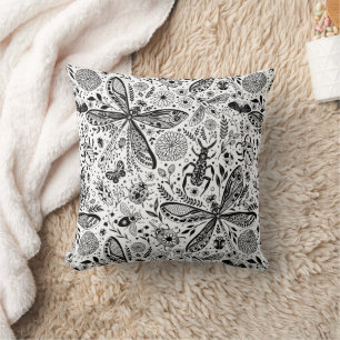 Doodle bugs on dark blue cushion