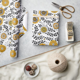 Doodle flowers and leaves in yellow and black wrapping paper