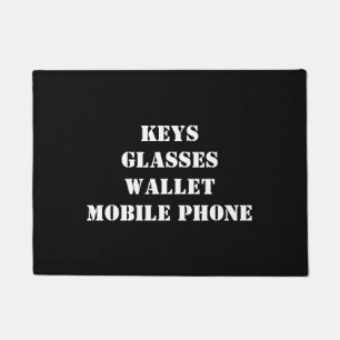 Doormat with keys, glasses, mobile phone, wallet
